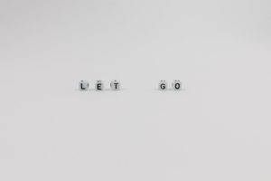 cubes spelling let go, signifying the best books on letting go